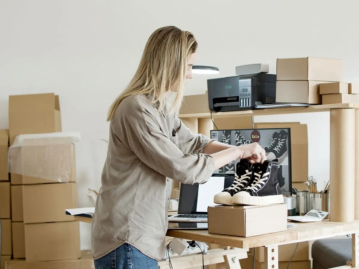 Online store owner packing an order