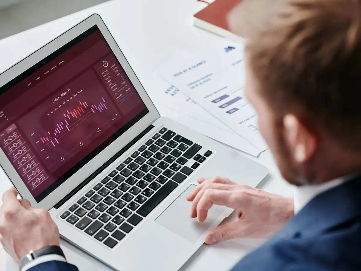 Business owner reviewing a dashboard on a laptop