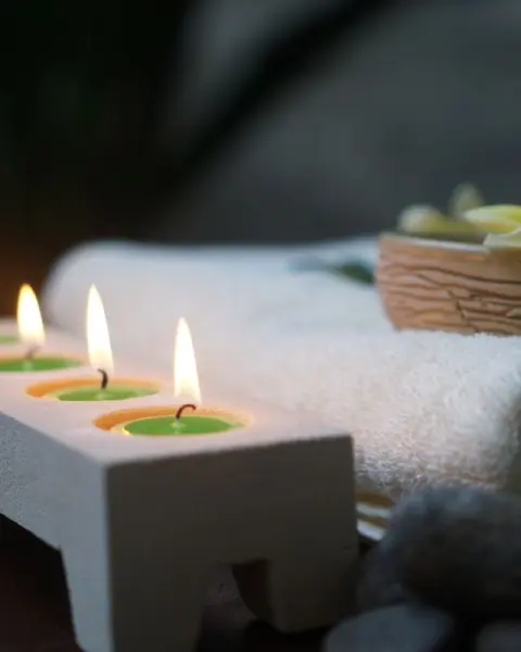Spa candles, towels and flowers ready for a treatment