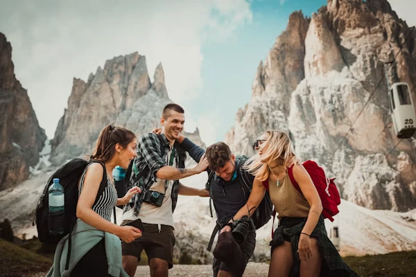 Tour group with backpacks exploring mountains