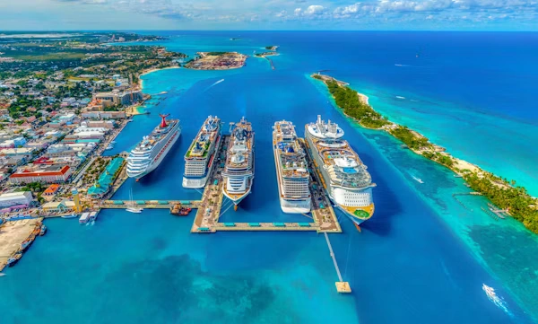 Cruise ships docked at tropical turquoise island harbor